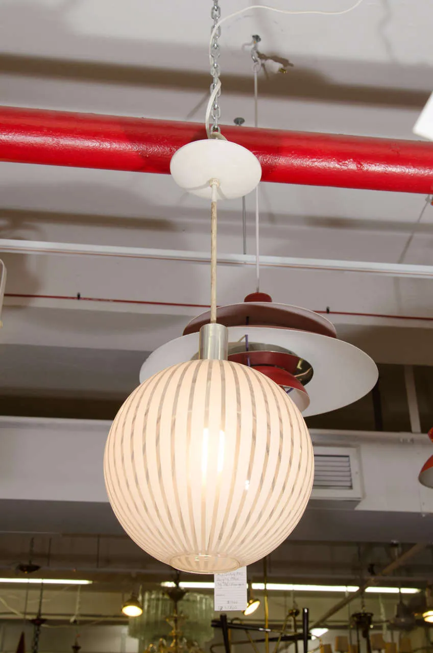 An Italian Clear Glass Globe Pendant with White Stripes