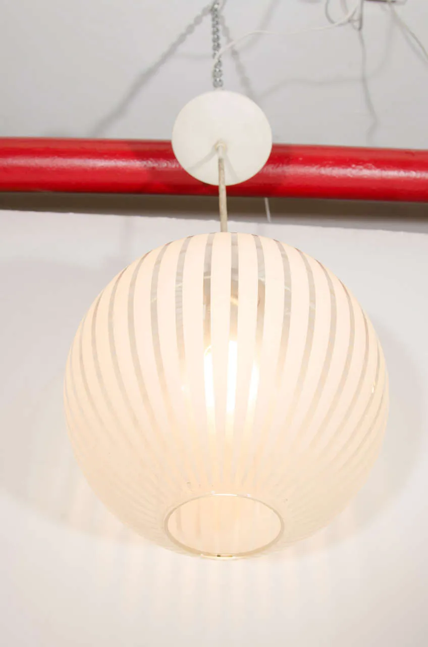 An Italian Clear Glass Globe Pendant with White Stripes